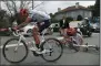  ?? FRANCK FAUGERE, POOL PHOTO VIA AP ?? Spain's Alberto Contador, front, gets back on his bicycle after crashing with his teammate Austria's Michael Gogl, rear, during the Tour de France cycling race Wednesday.