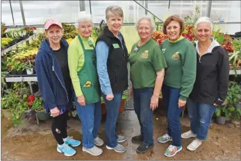  ?? STACI VANDAGRIFF/TRILAKES EDITION ?? Members of the Garland County Master Gardeners are ready for their annual plant sale and garden show, which will take place from 8 a.m. to 4 p.m. Saturday at the Garland County Fairground­s in Hot Springs. Shown with some of the plants that will be featured in the sale, including a wide variety of hanging baskets, are, from left, Jennifer Jennings of Hot Springs; Marty Lynch of Hot Springs; Paula Jackson of Lakeside, chairwoman of the garden show; Barbara Smith of Hot Springs, chairwoman of the greenhouse committee; Claudette Cooper of Lake Hamilton, plant sale chairwoman; and Carol Scrivner of Hot Springs.