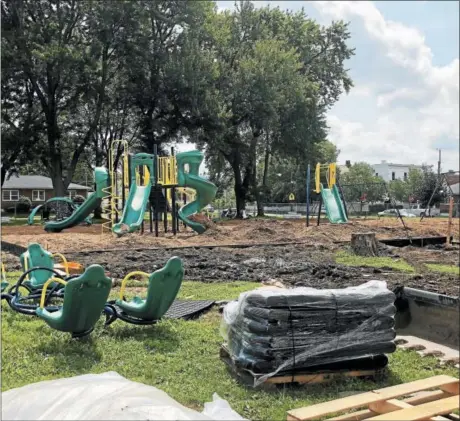  ?? NICHOLAS BUONANNO- NBUONANNO@TROYRECORD.COM ?? Resident of the village of Green Island have a new playground to use at Paine Street Park.