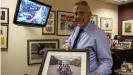  ??  ?? Ian Paisley Jr. presents a photo of himself with his famous father