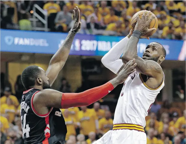  ?? TONY DEJAK / THE ASSOCIATED PRESS ?? LeBron James drives to the basket for two of his 35 points against the Raptors in Game 1 action in the Eastern Conference semifinal Monday.