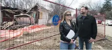  ?? KAYLE NEIS/FILES ?? The province must review the work plan and needs more informatio­n on worker safety before demolition of a house contaminat­ed with asbestos in Mayfair can proceed. Area residents Shannon Vinnish, left, and Daniel Gerle are shown outside the home earlier...