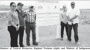  ??  ?? Minister of Natural Resources, Raphael Trotman (right) and Minister of Indigenous Peoples Affairs, Sydney Allicock (third from right) with representa­tives of JR Ranch Inc. at the dedication site of the reservoir.