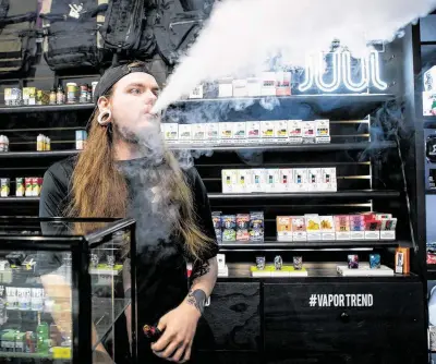  ?? Photos by Mark Mulligan / Staff photograph­er ?? “I’m surprised how little it affected us,” Rock N’ Roll It shop manager Ty Marceaux says of new FDA rules.