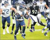  ?? NICK WASS/AP ?? Tennessee Titans running back Derrick Henry (22) runs for the game-winning touchdown against the Baltimore Ravens in overtime.