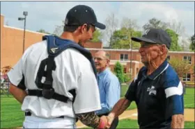  ?? PHOTOS BY BARRY TAGLIEBER — FOR DIGITAL FIRST MEDIA ?? Pottstown great Bobby Shantz, right, shakes hands with current Trojans player Josh Gery after throwing out the ceremonial first pitch prior to the game between Pottstown and Phoenixvil­le.