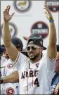  ?? TIM WARNER / GETTY IMAGES ?? World Series MVP George Springer of the Astros celebrates during Friday’s victory parade in Houston.