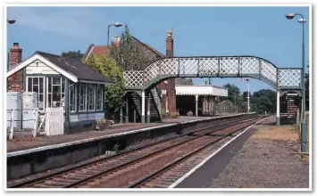  ??  ?? This delightful scene at Acle dating from July 1996 shows the platform-mounted signal box in almost original external condition. It dates from 1883 when the more direct route to Yarmouth was opened and controls the only passing loop between Brundall and Yarmouth.