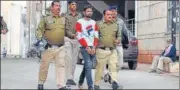  ?? HT PHOTO ?? Police personnel take accused in custody, in Rajasthan.