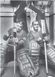  ??  ?? The Montreal Canadiens’ Vezinawinn­ing goalies Lorne “Gump” Worsley, left, and Charlie Hodge prepare for a 1966 training-camp game.