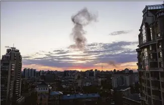  ?? John Moore / Getty Images ?? Smoke rises after an explosion at sunset on Thursday in Kyiv, Ukraine. The incident coincided with today’s visit to Kyiv by U.N. Secretary-General Antonio Guterres.