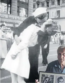  ?? Photo (left) / AP ?? George Mendonsa, pictured at 85, says the actions of war nurses spurred his V-J Day kiss.