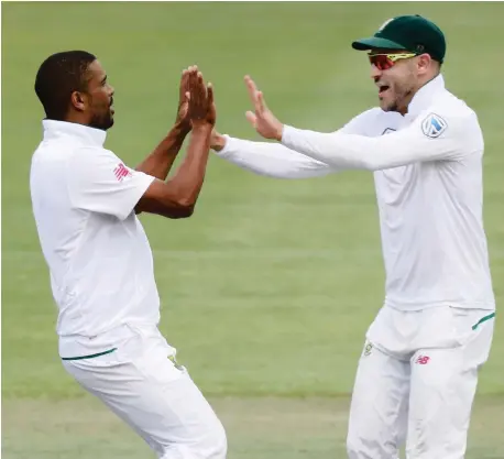  ?? Picture: BACKPAGEPI­X ?? DEMOLITION MAN: Vernon Philander celebrates with Faf du Plessis after taking the wicket of Rohit Sharma. Philander’s return of 6/42 was a career-best.