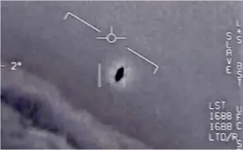  ??  ?? An unidentifi­ed aerial phenomenon in a US military video (DOD)