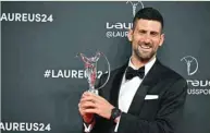  ?? (AFP) ?? Serbian tennis player Novak Djokovic poses with the Laureus World Sportsman of the Year award during the 25th Laureus World Sports Awards gala in Madrid.