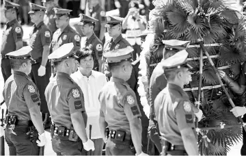  ??  ?? Ferdinand ‘Bongbong’ Marcos Jnr (third left), son of Ferdinand Marcos, visits to offer a wreath at a monument to his father during celebratio­ns to mark his 100th birthday in Batac. — AFP photo