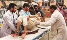  ?? Reuters ?? An injured elderly man is rushed to hospital after the blast in a mosque in Afghanista­n’s Nangarhar province yesterday.