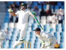  ??  ?? CAPTAIN'S KNOCK: South Africa's Faf du Plessis jumps to celebrate his century against New Zealand in the second Test at Centurion Park on Sunday. (Reuters)