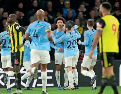  ?? AP ?? Manchester City’s players celebrate a goal against Watford during a Premier League match. —