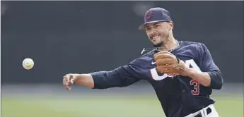 ?? CHRISTIAN PETERSEN Getty Images ?? MOOKIE BETTS is happy to see spot duty at second base for Team USA in the World Baseball Classic and his teammates are impressed by his ability. “He’s good at everything,” Trea Turner said. “He’s a freak.”