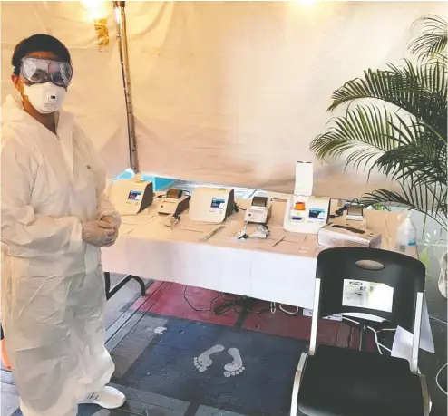  ?? GENE SLOAN / THE POINTS GUY / Handout via REUTERS ?? A medical worker stands works at a COVID-19 test centre after a number of passengers on the Seadream 1 Caribbean cruise were tested positive for COVID-19 in Barbados.