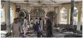  ?? aP ?? TARGETED: People view the damage inside of a mosque following a bombing in Kunduz, a province in northern Afghanista­n, on Friday.