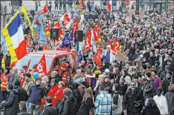  ?? Michel Spingler
The Associated Press ?? Protesters march Saturday during a demonstrat­ion against plans to push back France’s retirement age, in Lille, northern France.