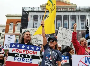  ?? Getty ImaGes ?? ‘WE WILL NOT COMPLY’: Demonstrat­ors gathered outside the State House in Boston Friday to protest COVID-19 vaccinatio­n and mask mandates.