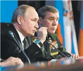  ?? MIKHAIL KLIMENTYEV/SPUTNIK ?? Russian President Vladimir Putin addresses an annual meeting with top military officials Tuesday in Moscow.