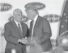  ?? KELLY WILKINSON, THE INDIANAPOL­IS STAR ?? Then President- elect Donald Trump and then- Indiana Gov. Mike Pence in December negotiated a deal to keep Carrier’s furnace factory in Indianapol­is open.