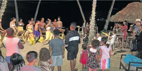  ??  ?? Guests enjoy the Vou Dance Group performanc­e at Shangri-La’s Fijian Resort and Spa’s first Beach, Beats and Eats weekend last month on Yanuca Island.