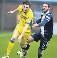  ??  ?? Blair Alston in a race for the ball with Staggies midfielder Jim O’Brien.
