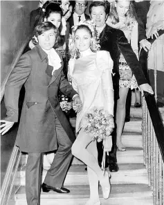  ??  ?? This file photo shows Tate and Polanski standing on the steps at the Chelsea register Office in London, after their wedding. — AFP photo