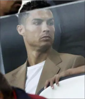  ?? LUCA BRUNO — THE ASSOCIATED PRESS FILE ?? Cristiano Ronaldo sits in the stands during a Champions League Group H match between Juventus and Young Boys in Turin, Italy on Tuesday.