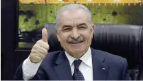  ?? AFP PHOTO ?? THUMBS UP
Palestinia­n Prime Minister Mohammad Shtayyeh gives a thumb-up sign at a Cabinet meeting in the West Bank city of Ramallah on Monday, Feb. 26, 2024.