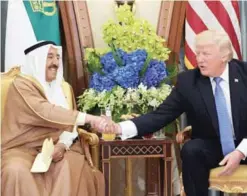  ?? —AFP ?? RIYADH: (Left) US President Donald Trump and HH the Amir of Kuwait Sheikh Sabah Al-Ahmad Al-Jaber Al-Sabah take part in a bilateral meeting at a hotel yesterday. (Right) Trump, Saudi Arabia’s King Salman bin Abdulaziz, HH Sheikh Sabah, Jordan’s King...