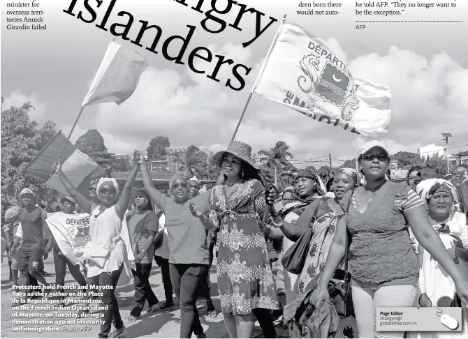  ?? Photo: AFP ?? Protesters hold French and Mayotte flags as they gather on the Place de la Republique in Mamoutzou, on the French Indian Ocean island of Mayotte, on Tuesday, during a demonstrat­ion against insecurity and immigratio­n.