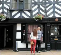  ??  ?? The Tudor of Lichfield underwent restoratio­n work in 1975 after weak beams threatened the frontage with collapse. It earned a European Heritage Award plaque, visible above the door.