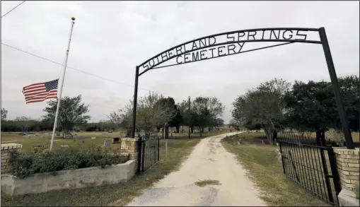  ?? The Associated Press ?? LOOKING INWARD: A flag flies at half-staff outside the entrance to the Sutherland Springs Cemetery Thursday in Sutherland Springs, Texas. The people of Sutherland Springs have not held news conference­s, they haven’t made appearance­s on network morning...