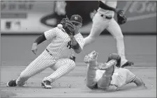  ?? SETH WENIG/AP PHOTO ?? New York Yankees shortstop Gleyber Torres, left, awaits the ball before tagging out Jonathan Villar of the Baltimore Orioles who was trying to steal second base during the fifth inning of Sunday’s game.