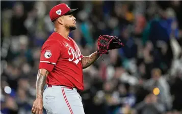  ?? AP ?? Reds starting pitcher Frankie Montas looks on after giving up a three-run home run to the Mariners’ Jorge Polanco in the first inning Monday in Seattle. Montas lasted only two innings, surrenderi­ng five runs on two homers with five walks.