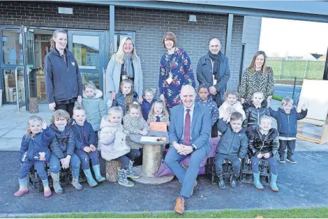  ?? ?? Superb spaces Frank Mcnally helps the children unveil the new Shawhead Primary nursery spaces