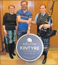  ??  ?? Directors of Beinn an Tuirc Distillery, Emma and Niall Macalister Hall, with 3A band pipe major Julie Blue.
