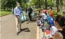  ?? Photograph: Ron Adar/SOPA Images/REX/ Shuttersto­ck ?? New York City mayor Bill de Blasio distribute­s face masks at Flushing Meadows Corona Park in the Queens on Saturday.