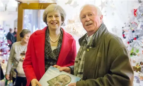  ?? ?? Above: Gordon Storey with Theresa May
Far left: Sasan StarrPadid­ar was preparing for a very severe hair and beard cut
Left: Aldi introduced a new parking system that gave people £70 fines if they didn’t register their car
