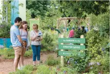  ?? PHS ?? Visitors check out a Pennsylvan­ia Horticultu­ral Society Garden for the Greater Good exhibit comprised of native plants and pollinator­s at the 2022 Philadelph­ia Flower Show.