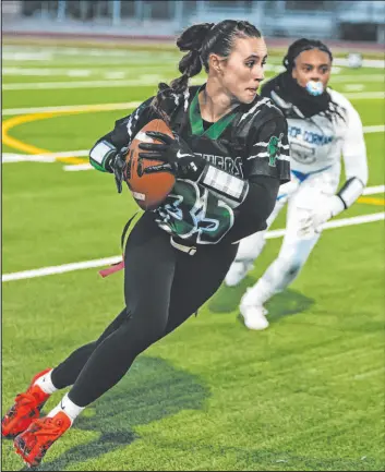  ?? Madeline Carter Las Vegas Review-journal ?? Palo Verde defensive back Tia Brown runs with the ball in the No. 2 Panthers’ 25-14 home victory over No. 4 Bishop Gorman on Friday.