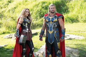  ?? Marvel Studios ?? ■ Natalie Portman, left, and Chris Hemsworth in a scene from "Thor: Love and Thunder."
