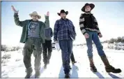  ?? RICK BOWMER / AP ?? In this Jan 8, 2016, file photo, Burns resident Steve Atkins, left, talks with Ammon Bundy, center, one of the sons of Nevada rancher Cliven Bundy, following a news conference at Malheur National Wildlife Refuge near Burns, Ore. Cliven and his sons, Ryan and Ammon, have engaged in armed standoffs with the federal government.