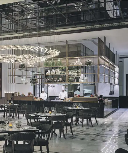  ?? Photos Brasserie Boulud ?? Brasserie Boulud in Dubai features a mirrored ceiling and dramatic chandelier­s